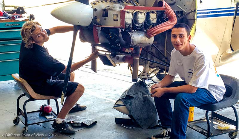 Student pilots and soon to be A&P mechanics, Jacob Glasson and Lucas Graybill, at A Different Point of View's maintenance workshop